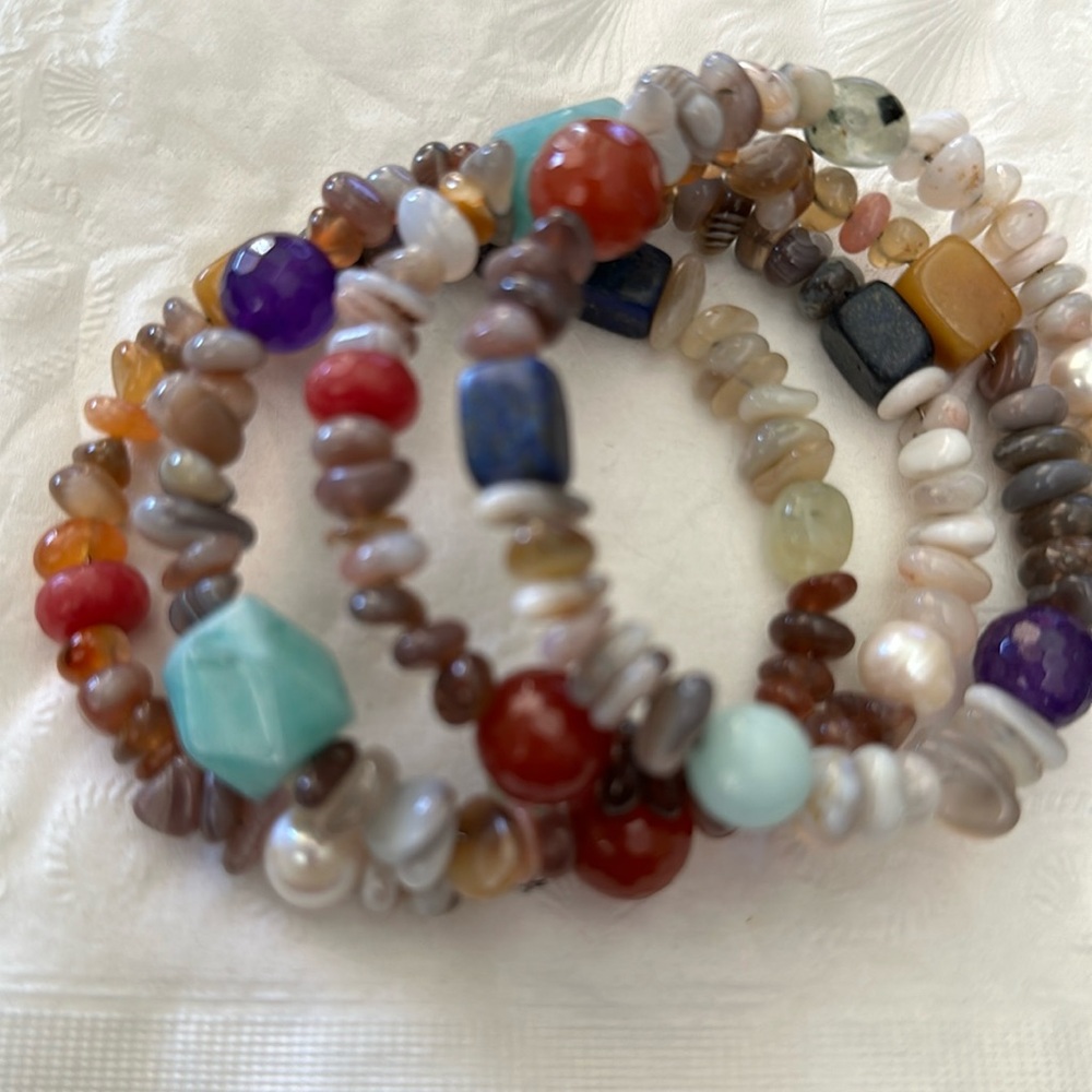 Four strand faux stone bracelet on elastic wrap.